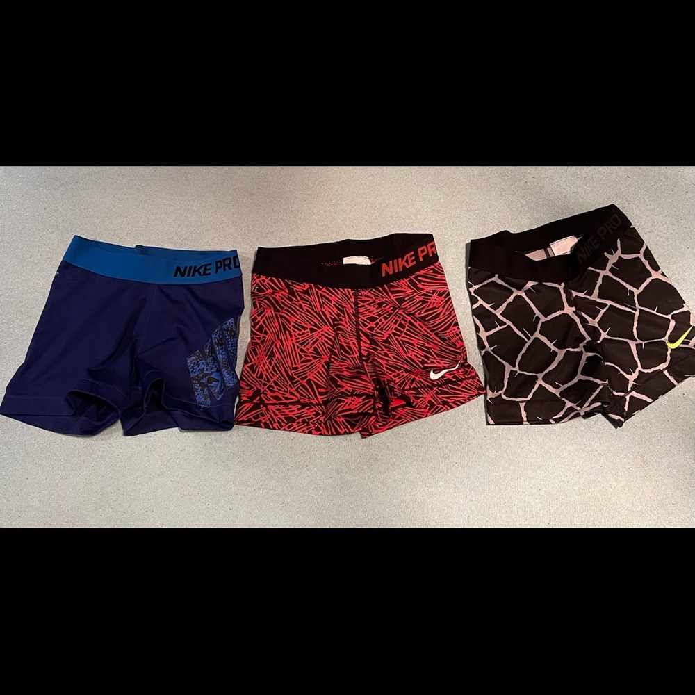 Three pairs of Nike Pro shorts, all shorts are size XS